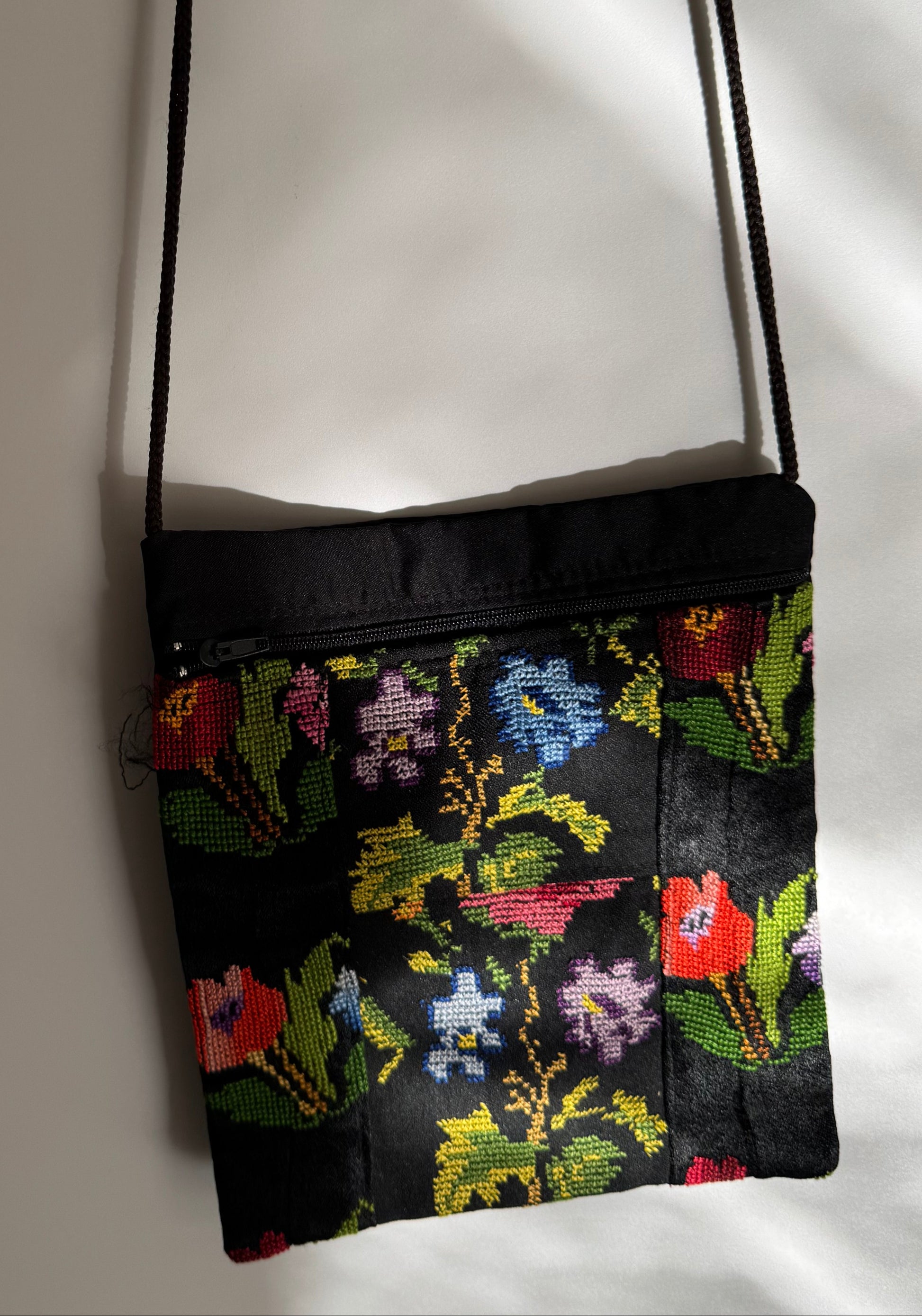 Floral-patterned pouch on a white background